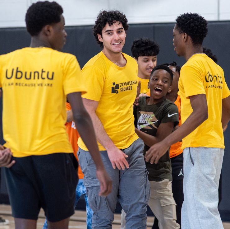 Picture of school principal discussing a student's behaviour with the young kid and his parent
